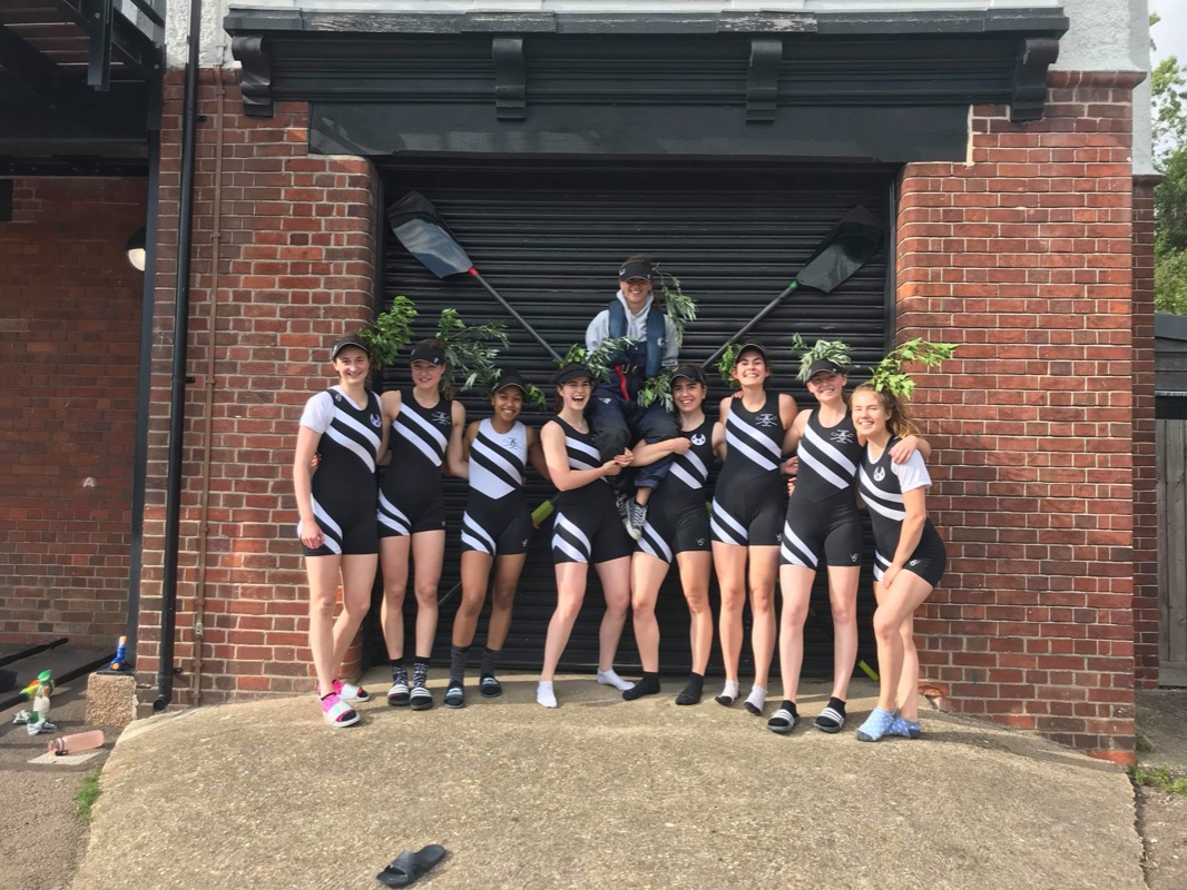 Trinity Hall rowing crew celebrating with laurel wreaths after winning Blades
